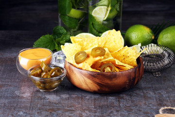 A plate of delicious tortilla nachos with melted cheese sauce