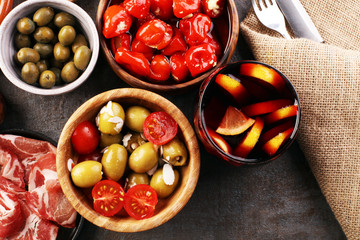 spanish tapas and sangria on wooden table - mediterran antipasti set