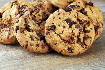 Chocolate cookies on wooden table. Chocolate chip cookies shot