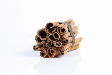 Roll of cinnamon stick isolated with whit background