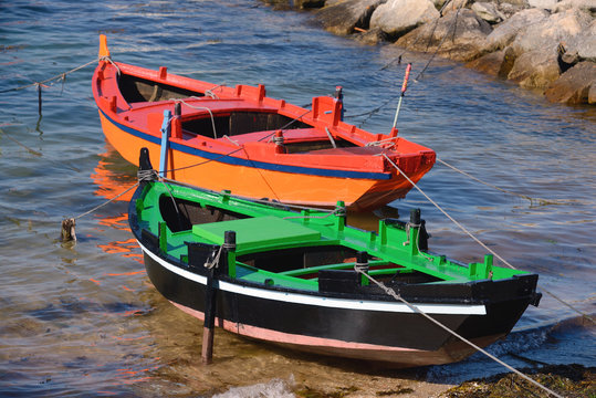 wooden fishing boats on the shore