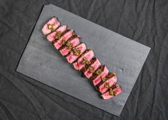 New york strip porterhouse steak meat against black background