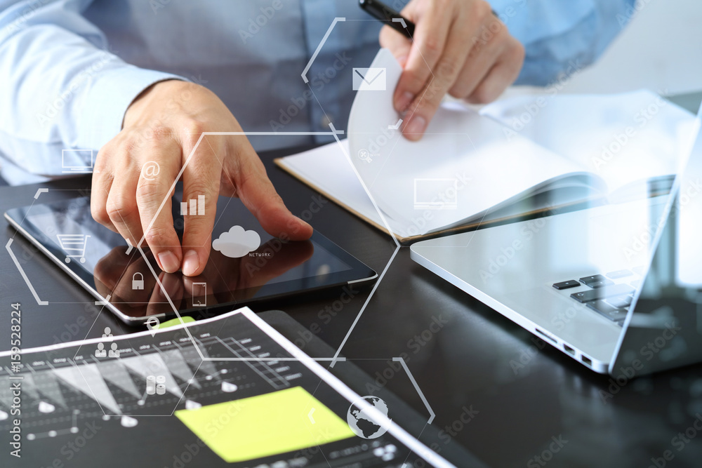 Poster close up of businessman working with smart phone and digital tablet and laptop computer on wooden de