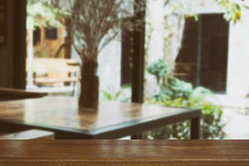 table and chair in food court, cafe, coffee shop, restaurant interior with wood table for montage or display your product