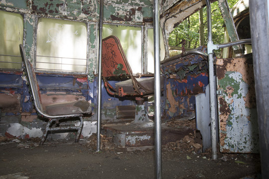 Colorful drivers seats of abandoned trolley car