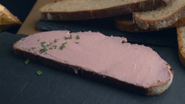 Slice of bread coated with liver pate