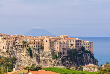 Obraz premium Tropea, a famous bathing place situated on a reef in the gulf of St. Euphemia with the Aeolian Island Lipari in the background - Calabria, Italy