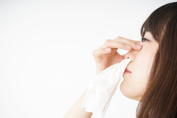 Young woman getting a bloody nose