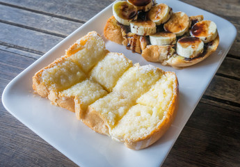 Bread with banana chocolate and butter with sweetened condensed milk