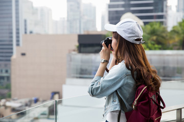 Young asian lady traveling in city center