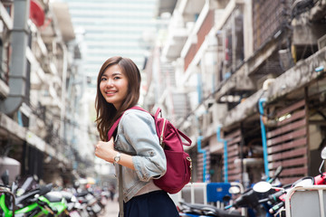 Young asian lady traveling in city center