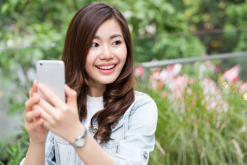 Young asian lady take selfie