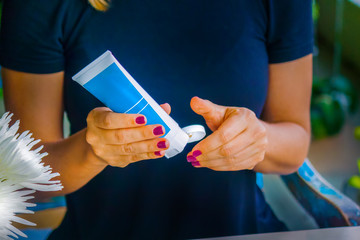 Hand applying cream