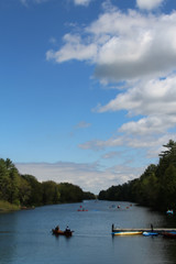 Fototapeta na wymiar Canoes and kayaks on a river in Ontario Canada