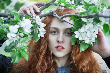 Naklejka premium Young redhead girl outdoors