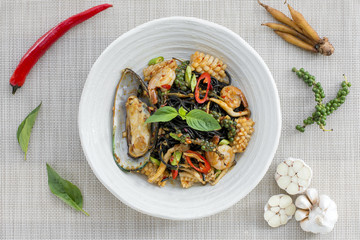Stir-fried spicy spaghetti black ink with seafoods