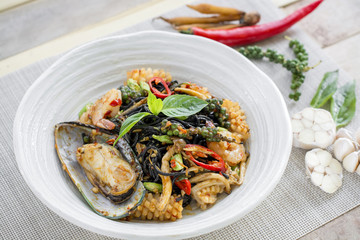 Stir-fried spicy spaghetti black ink with seafoods
