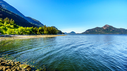 The waters of Howe Sound and surrounding mountains along Highway 99 between Vancouver and Squamish, British Columbia. Viewed from the Porteau Cove ferry docks 