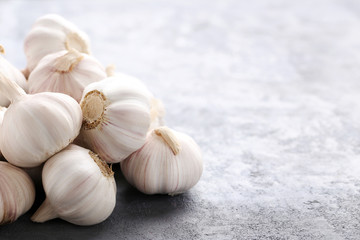 Garlic on the grey wooden table