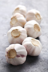 Garlic on the grey wooden table