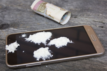 heroin on the phone. associated money with the rubber band.