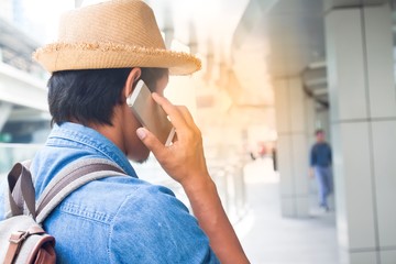 Young asian tourist man using smartphone, Travel and Lifestyle concept