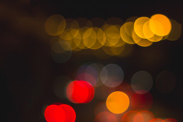 Abstract circular bokeh background of traffic lights on the Road