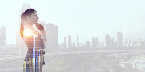 Thoughtful businesswoman with hand on chin