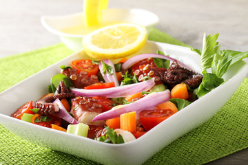 Fresh octopus salad with tomato and onion - 159546239