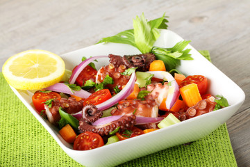 Fresh octopus salad with tomato and onion - 159546242