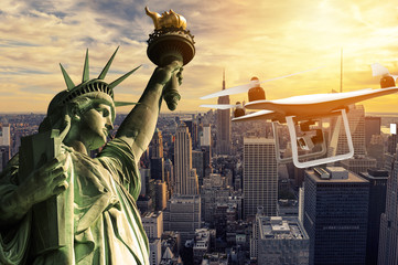 Drone with digital camera flying over statue of liberty © Cla78