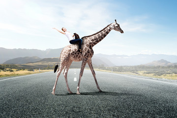 Girl saddle giraffe © Sergey Nivens