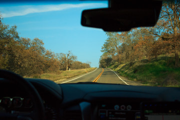 Photo of infinite road seen through windshield