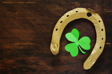The symbol of St. Patrick's Day is a golden horseshoe and a clover
