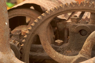 Old rusty gears, machinery parts.