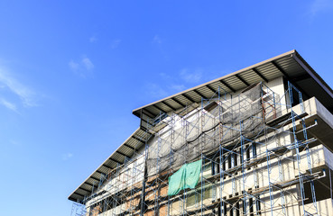 building construction site with blue sky background. over light 