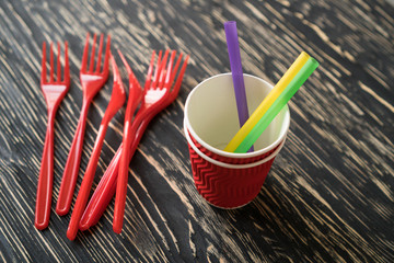 Cups and red forks.