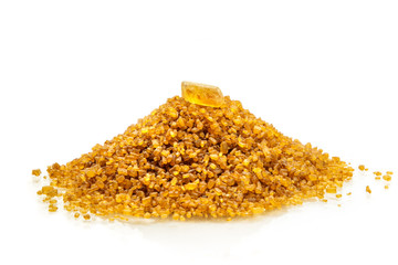 Sugar candy on top of mound of brown sugar