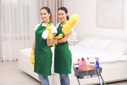 Cleaning service team at work in bedroom