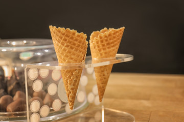 Waffle cones for ice cream in holder on counter
