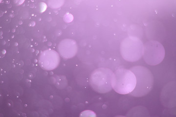 A beautiful and blurry bokeh on a purple background.