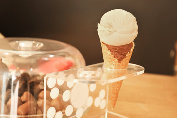 Portion of ice cream in holder on table