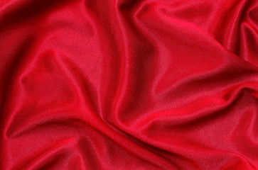 Red fabric pattern texture background, abstract background luxury cloth or liquid waves of grunge silk.