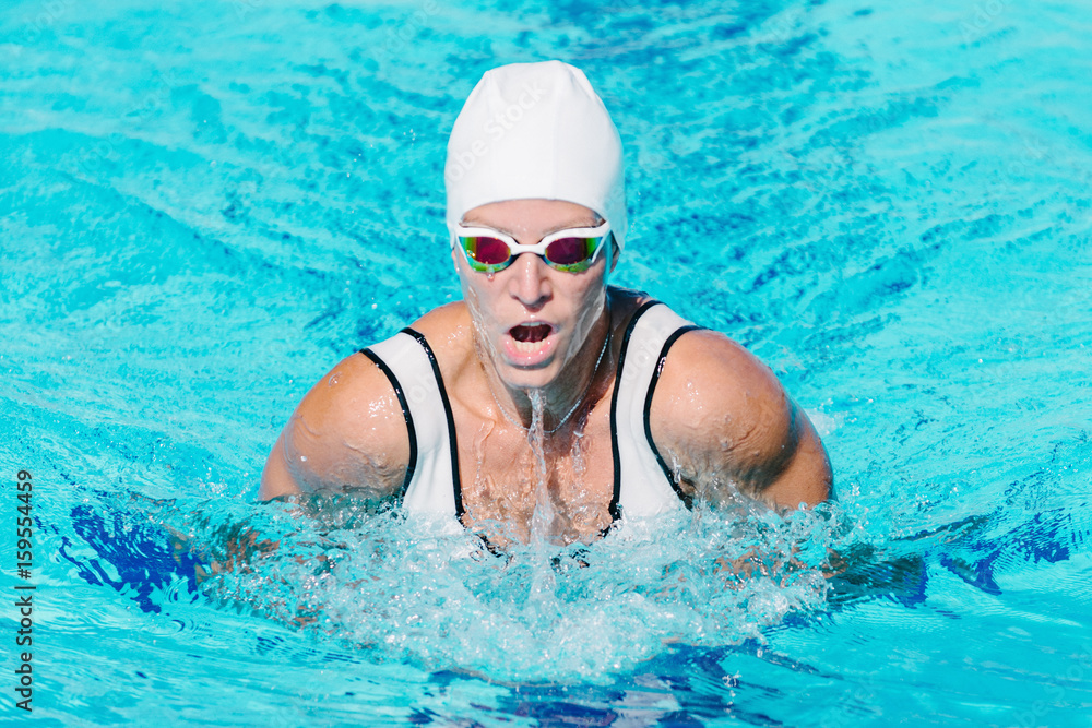 Wall mural female swimmer on training in the swimming pool