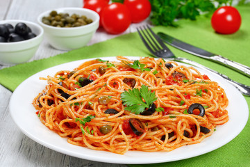 Pasta with tomato, capers, anchovy and olives