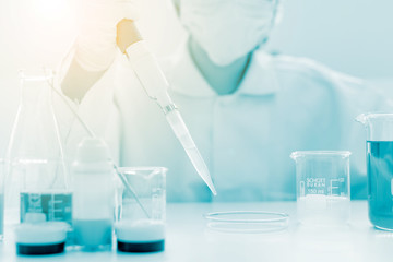 scientist hand holding laboratory test tube, science laboratory research and development concept