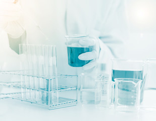 scientist hand holding laboratory test tube, science laboratory research and development concept