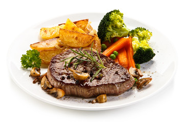Grilled beefsteak with broccoli and carrot on white background
