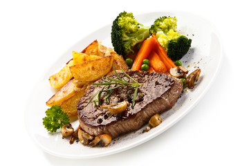 Grilled beefsteak with broccoli and carrot on white background