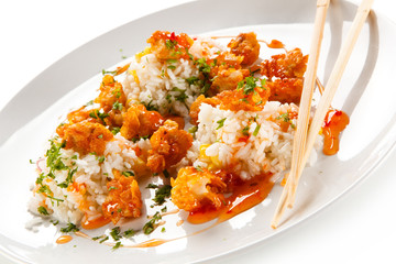 Chicken nuggets with rice on white background 